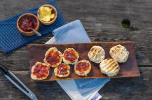 Dale Tilbrook Aboriginal woman making damper rolls with native quandong jam